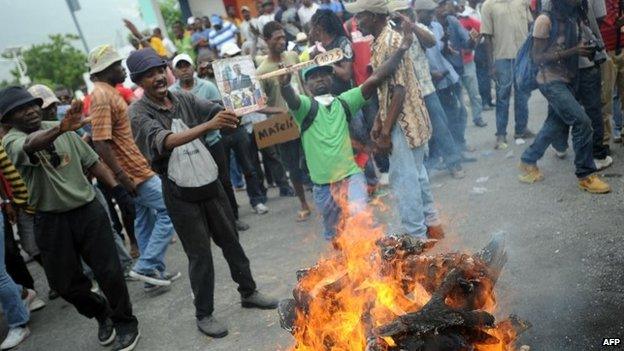 Demonstrators perform a voodoo ceremony before an anti-government protest in Port-au-Prince, Haiti, 5 June 2014