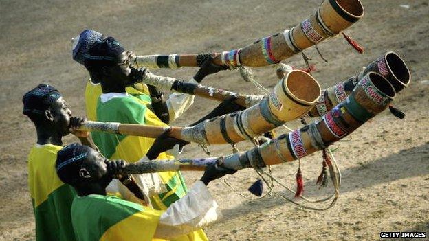 Men blow a traditional horn part of a Durbar that Prince Charles attended in 2006