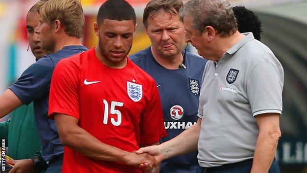 England midfielder Alex Oxlade-Chamberlain and manage Roy Hodgson