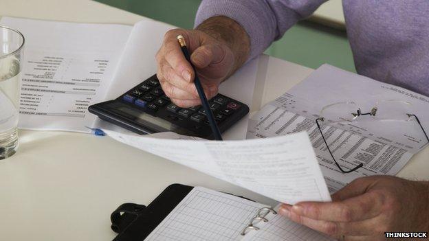 A man looks through his paperwork