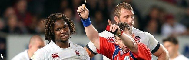 Nigel Owens shows Marland Yarde a yellow card