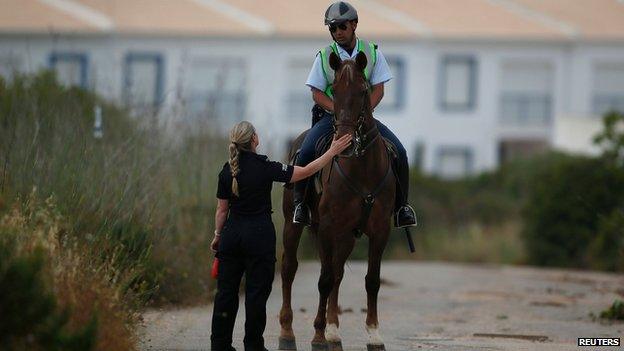 An officer on horseback during the search