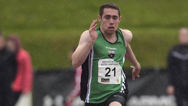 Jason Smyth battles in the rain at the Northern Ireland Athletics Championship on Saturday