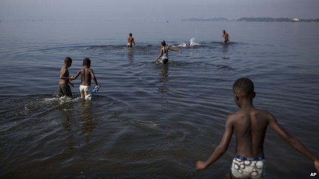 Bathers in Rio's Guanabara Bay