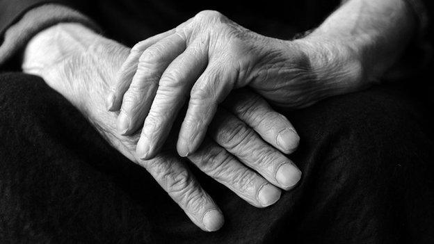 The hands of an elderly man