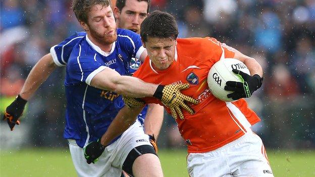 Armagh's Stefan Campbell attempts to burst away from Cavan's Rory Dunne at the Athletic Grounds