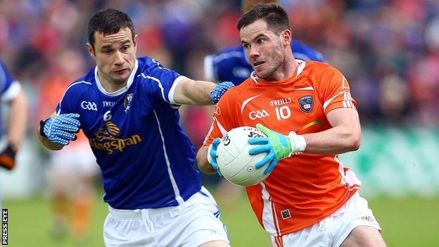 Cavan's Alan Clarke attempts to keep pace with Armagh's Eugene McVerry