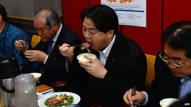 Japanese Agriculture Minister Yoshimasa Hayashi (2nd R), during an event to promote whale meat