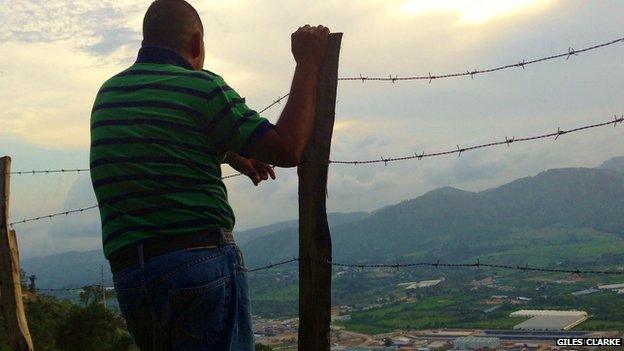 Activist Erick Fernando Castillo Perez looks down at the Escobal silver mine