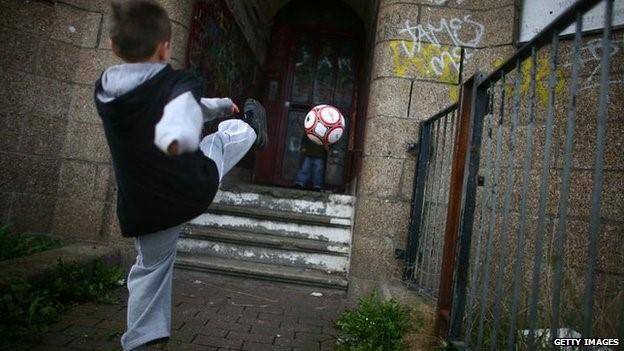 Child playing at football