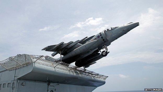 A Harrier jet of 1(F) Joint Force Squadron takes off from the flight deck of HMS Ark Royal