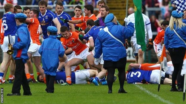 Young members of a band were ushered to safety as players of Armagh and Cavan fought before the match