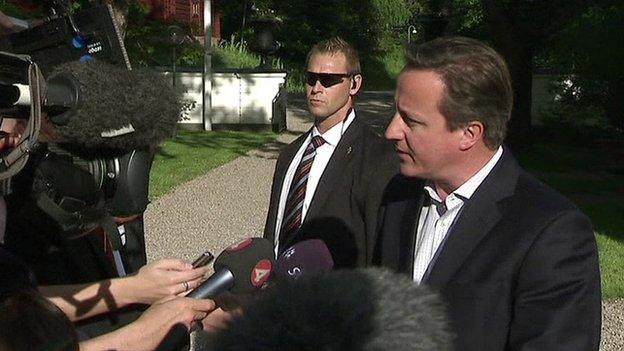 David Cameron speaking to the media in Sweden