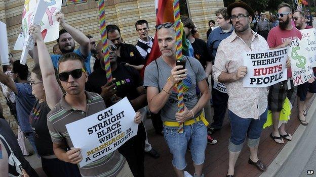 Gay rights activists protest outside the Texas Republican Convention on 5 June, 2014.