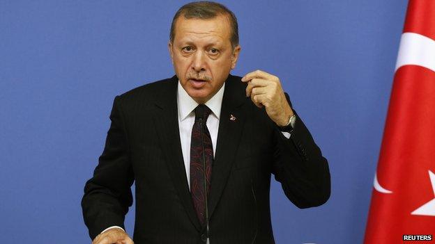 Turkish Prime Minister Tayyip Erdogan reacts during a news conference in Ankara June 9