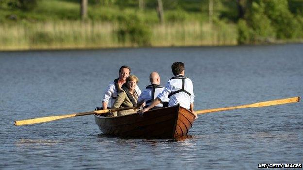 David Cameron, Angela Merkel, Fredrik Reinfeldt and Mark Rutte talk in a boat near the summer residence of the Swedish Prime Minister