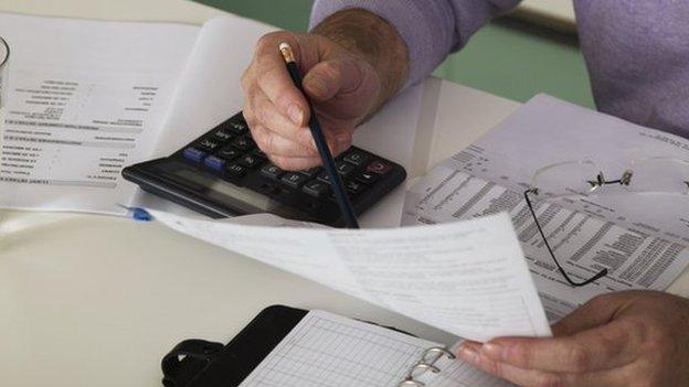 A man looks through his paperwork