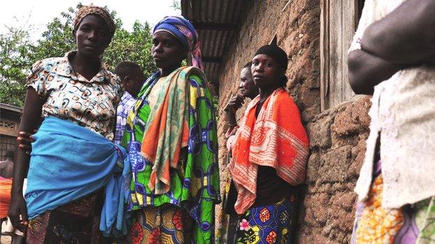 Fidela (in the blue skirt on the left)