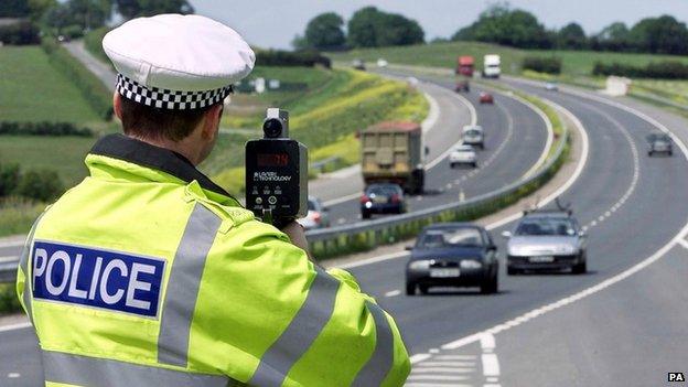 A police officer carrying out a speed check