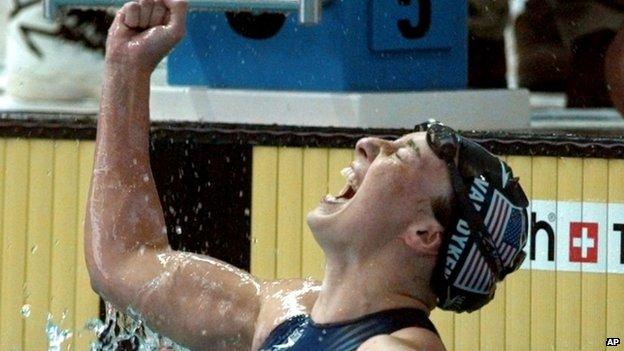 Amy Van Dyken of the United States celebrates after winning the gold medal in the women's 50 meter freestyle at the 1996 Summer Olympic Games in Atlanta. 26 July 1996