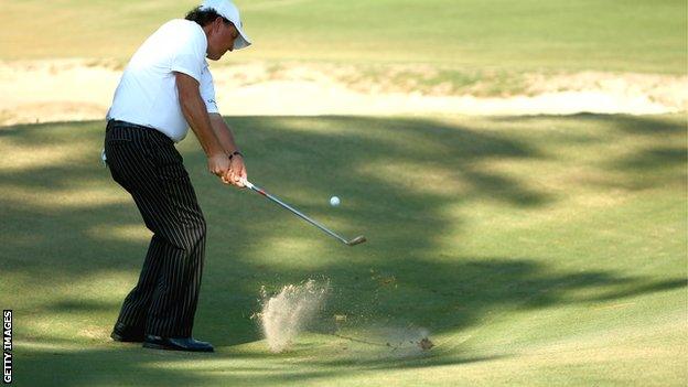 Phil Mickelson chips during US Open practice at Pinehurst