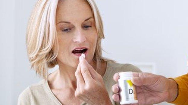 Woman taking pill