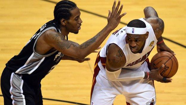 Miami Heat's LeBron James (right) was outscored by San Antonio Spurs's Kawhi Leonard (left)