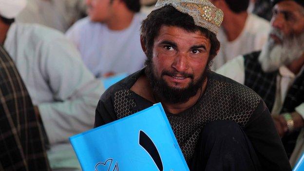 A supporter of Abdullah Abdullah at a campaign event in Kandahar