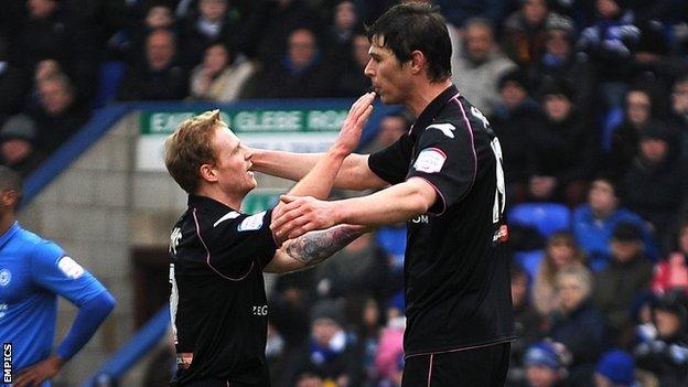 Chris Burke and Nikola Zigic