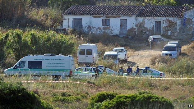 Police and vehicles at the second search site