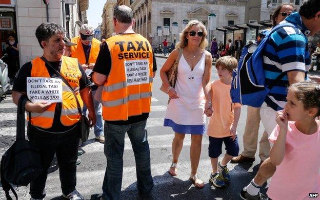 Rome taxis drivers distribute leaflets during strike