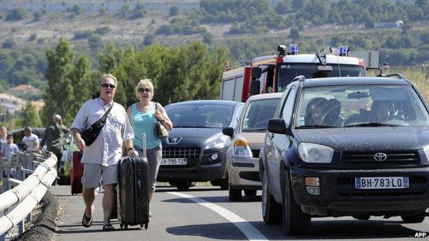 Passengers in Marignane near Marseille walk to the airport