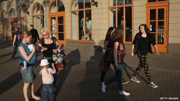 People stroll through the old city centre of Riga (May 2014)