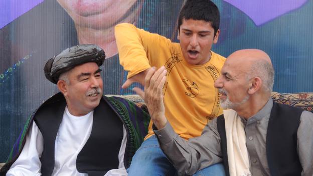 Ghani (right) with Dostam and a young boy