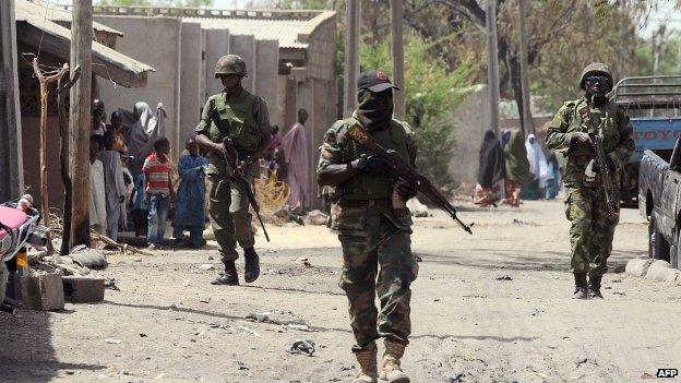 Nigerian troops patrolling the streets of the remote north-eastern town of Baga, Borno State (April 2014)
