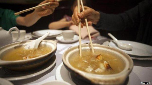 Shark fin soup is served during a Chinese dinner banquet at a hotel in Hong Kong on 7 August 2013