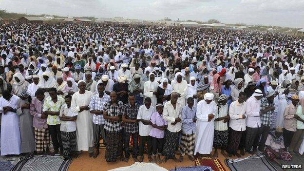 Somali refugees pray during celebrations of the Eid al-Fitr in the Ifo marketplace in Kenya's Dadaab refugee camp - 2011