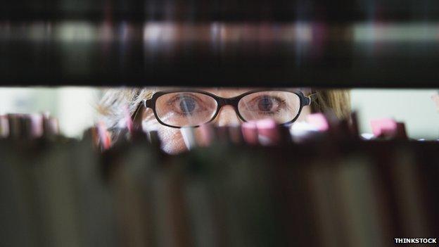 Woman looking through shelves