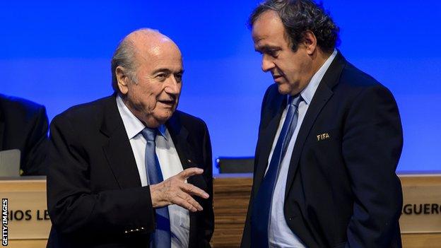 Sepp Blatter talks to his counterpart, and potential rival for office, Michel Platini in Sao Paulo