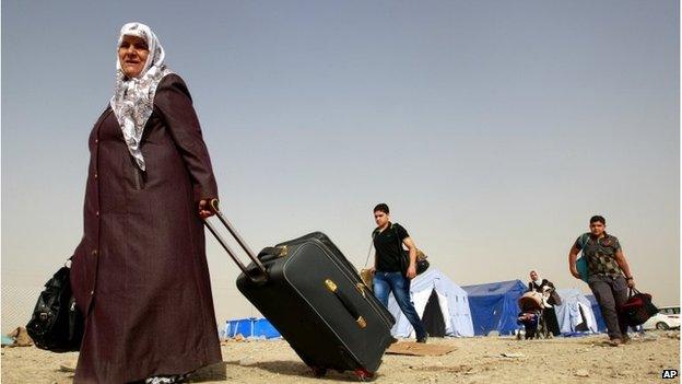 Refugees fleeing Mosul arrive in Irbil on 12 June