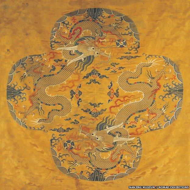 This silk brocade features two Mang dragons. Mang dragons are distinguished by having four-talon claws while imperial dragons have five-talon claws.