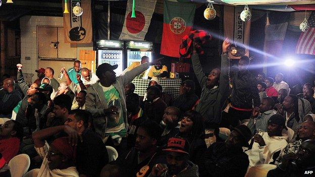 Kenyan football fans cheer as Brazil scores their first goal in a pub in Nairobi, Kenya - 12 June 2014