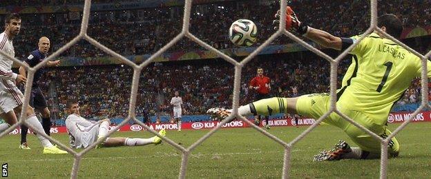 Iker Casillas of Spain concedes a goal to Netherlands