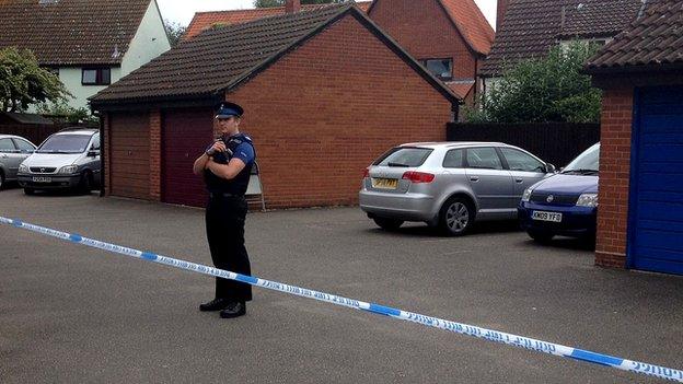 The woman's body was found inside a property in Martlesham Heath