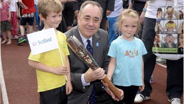 First Minister Alex Salmond with Craig Burns, seven, and Marilee Burns, five, at Meadowbank Stadium