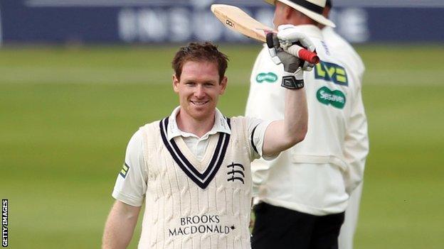 Eoin Morgan raises his bat to mark his second century in successive Championship matches