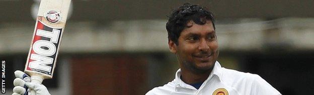 Sri Lankas Kumar Sangakkara celebrates reaching a century during the third days play in the first cricket Test match between England and Sri Lanka at Lord's.