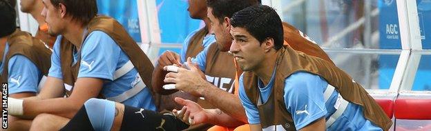 Luis Suarez of Uruguay looks on from the bench against Costa Rica.