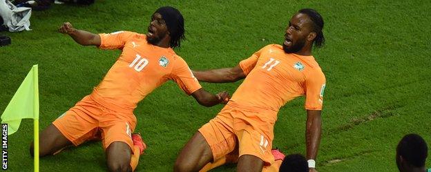 Gervinho (left) celebrates scoring with Didier Drogba as Ivory Coast came from behind to beat Japan at the World Cup