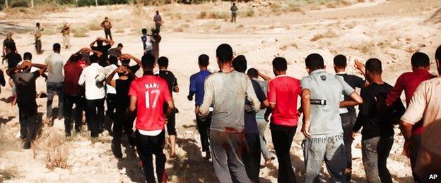 Photograph purportedly showing Iraqi soldiers being led towards militants from the Islamic State in Iraq and the Levant (ISIS) prior to their execution